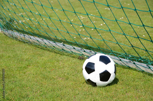 Soccer ball at the goal net © pincasso