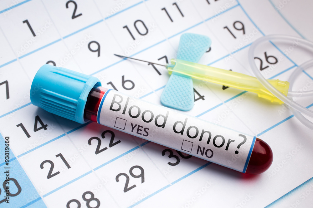 blood tube labeled with the donor blood question / planning calendar and blood sample in tube labeled with blood donor question blood tube labeled with the donor blood question / planning calendar and blood sample in tube labeled with blood donor question