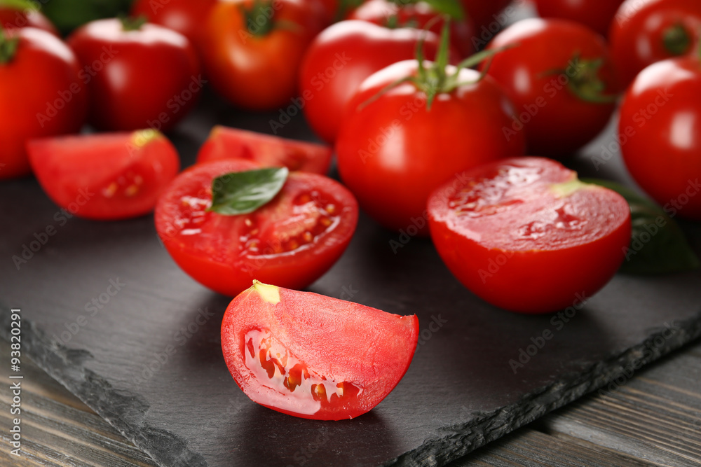 Red tomatoes on wooden background Red tomatoes on wooden background