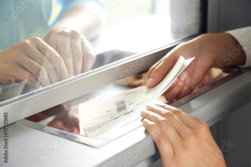 Woman buying tickets at box office