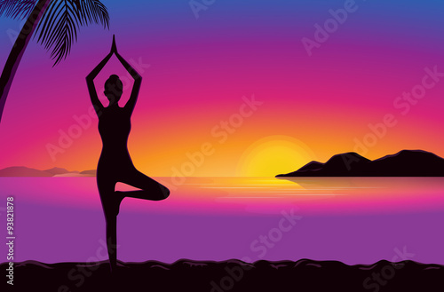 Woman doing exercise with yoga in seaside at the sunset time