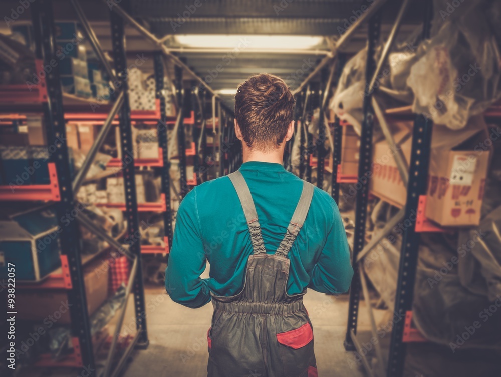 Worker on a automotive spare parts warehouse