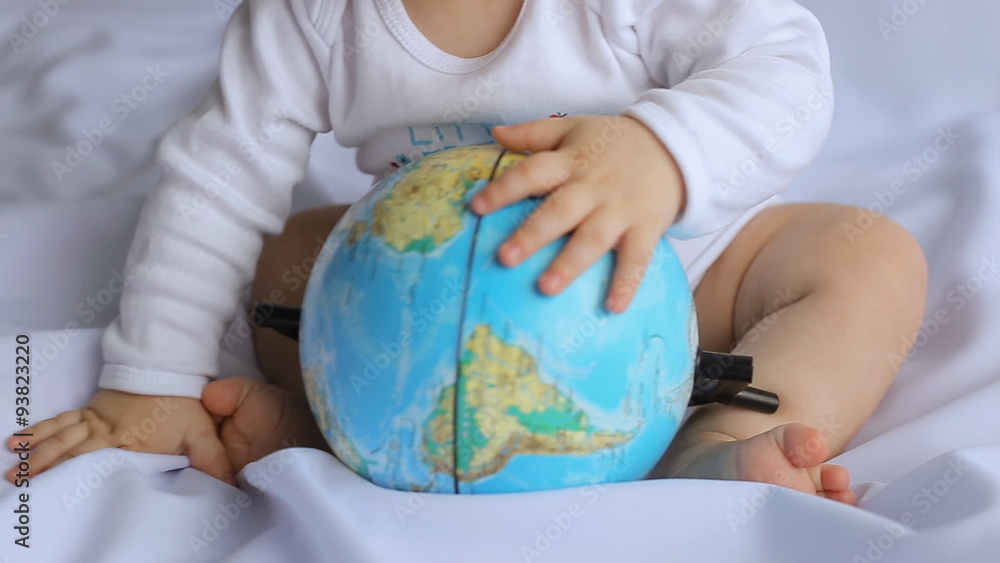 little boy playing with an globe little boy playing with an globe