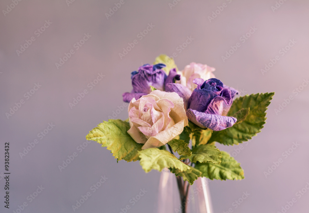 Closeup purple paper roses vintage tone style 
