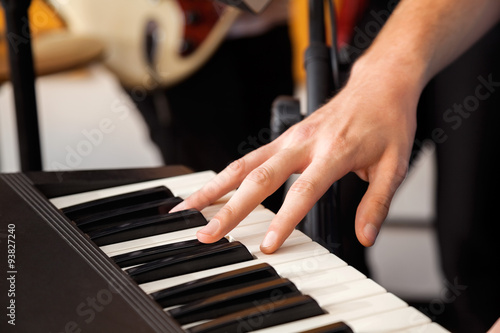 Hand Playing Piano In Recording Studio