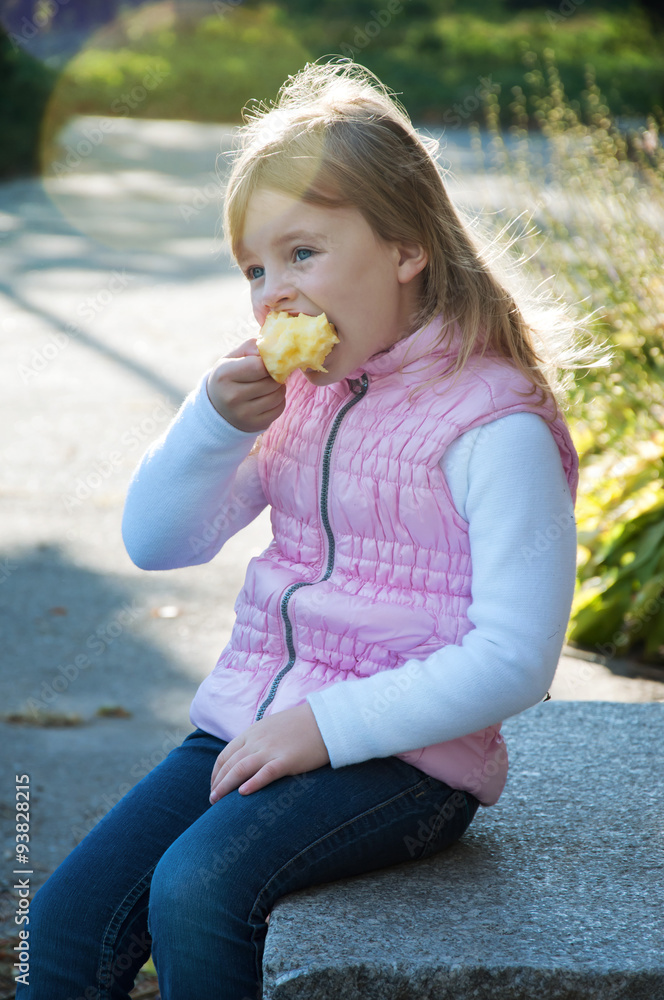 Cute little girl in autumn outfit in an apple orchard Cute little girl in autumn outfit in an apple orchard