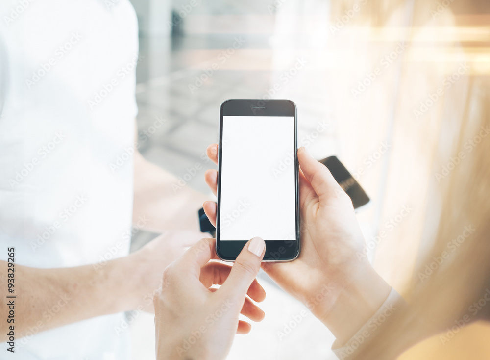 Guy and a girl holding in hands their gadgets. Blurred Guy and a girl holding in hands their gadgets. Blurred