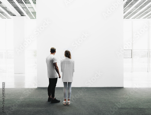 Man and woman walking through the gallery  photo
