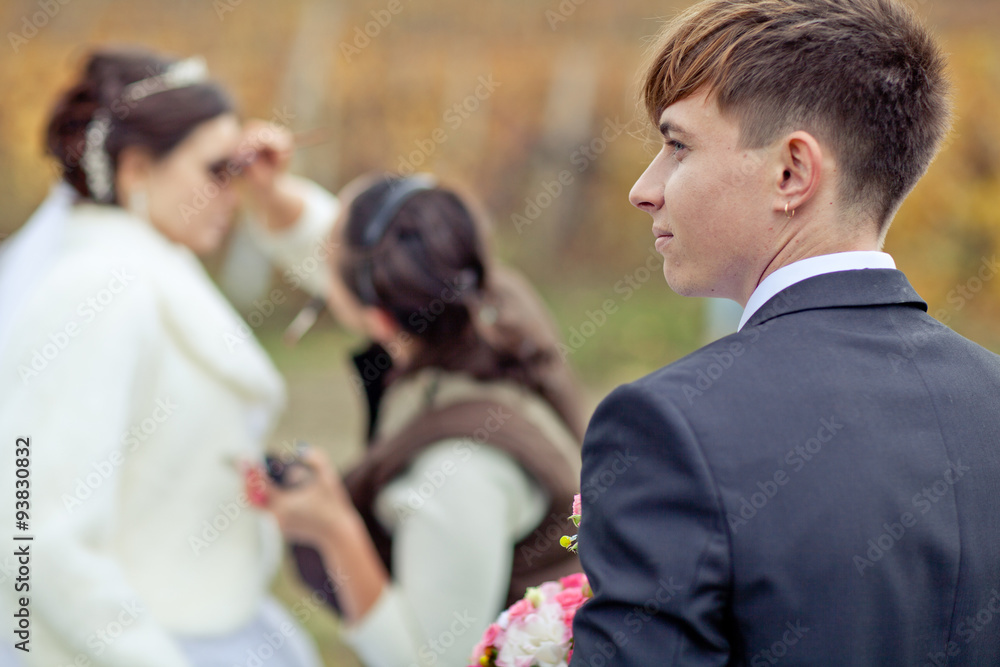 A groom in autumn forest in smoking A groom in autumn forest in smoking