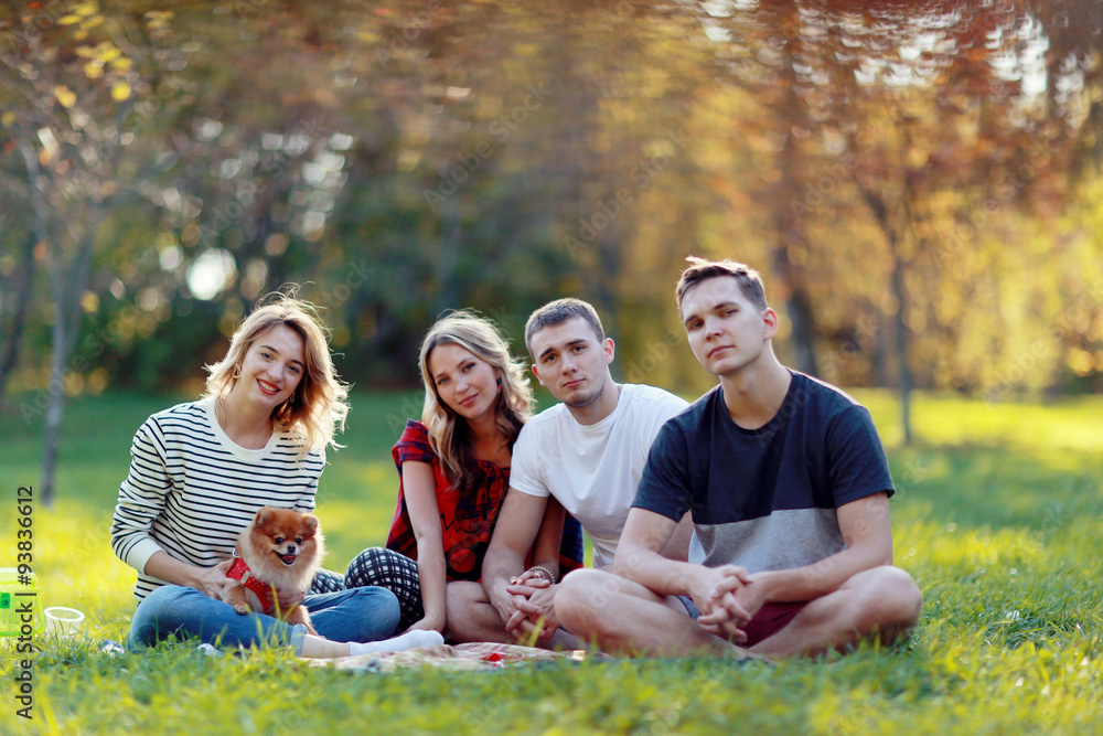 young people in autumn park in Europe young people in autumn park in Europe