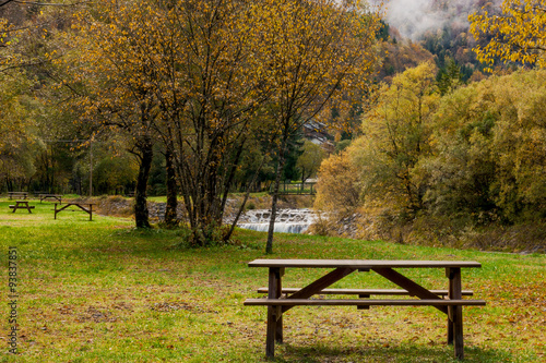 The bench in park in autumn photo