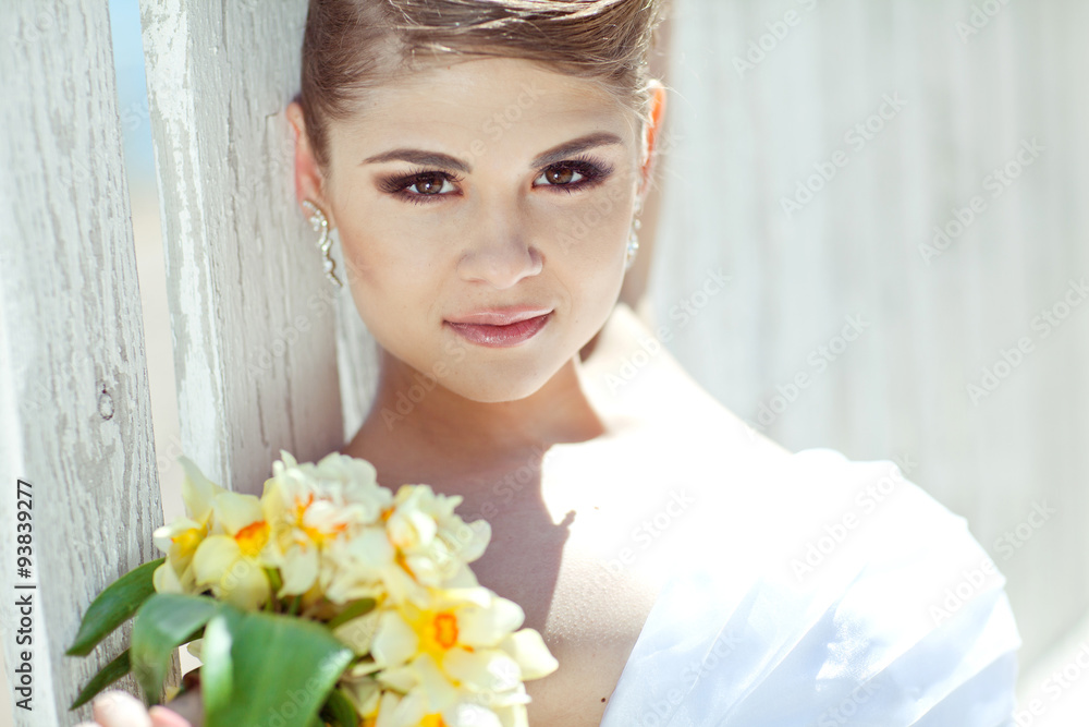 Beautiful bride with bouquet on the beach restorant Beautiful bride with bouquet on the beach restorant
