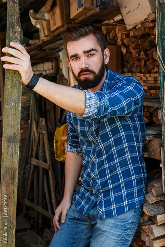 Bearded man in checkered shirt
