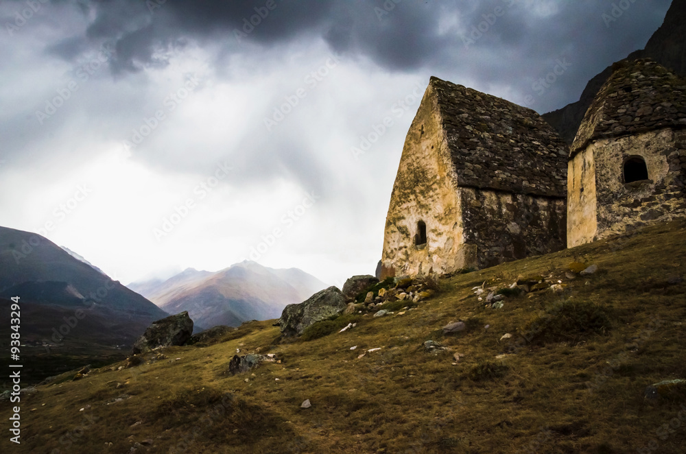 Two crypt on the background of a stormy sky in the Chegem gorge