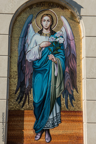 Religious painting representing an angel with flowers