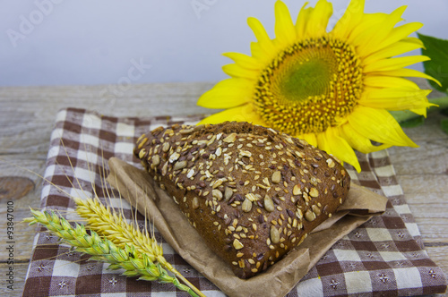 Fresh bread. Pieces of bread with sunflower seeds. Loaf of whole