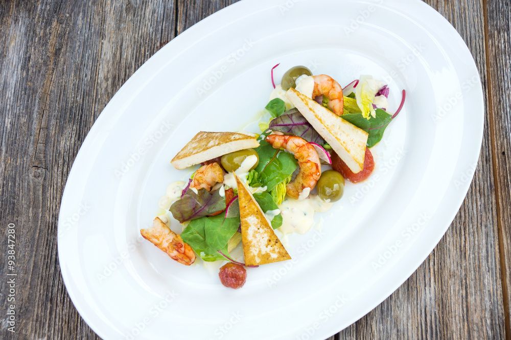 Prawns salad on a wooden background Prawns salad on a wooden background