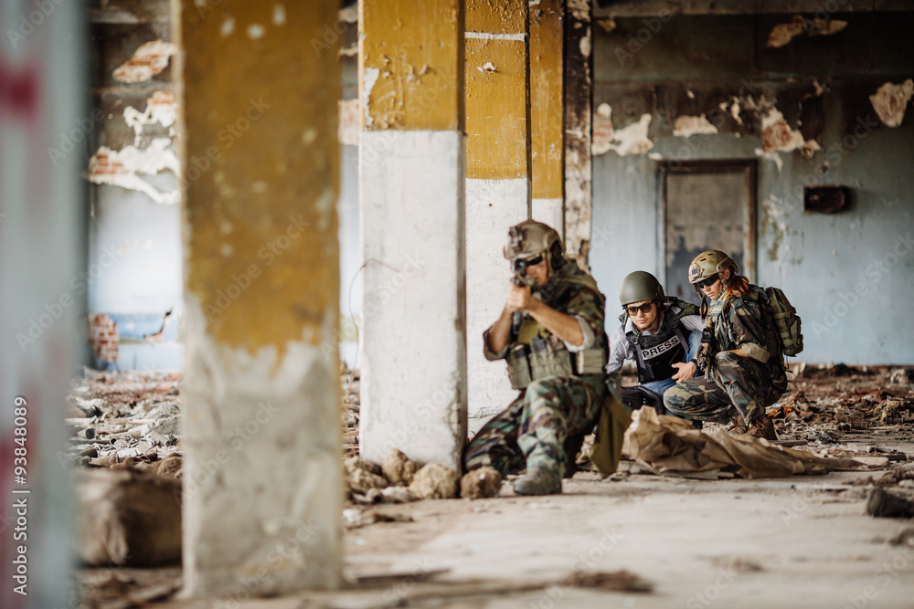 Photojournalist documenting war conflict Photojournalist documenting war conflict
