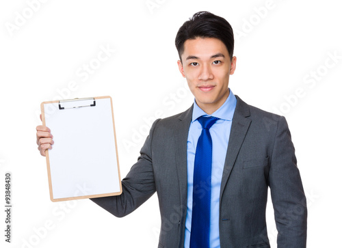 Asian young Businessman show with the blank page of clipboard