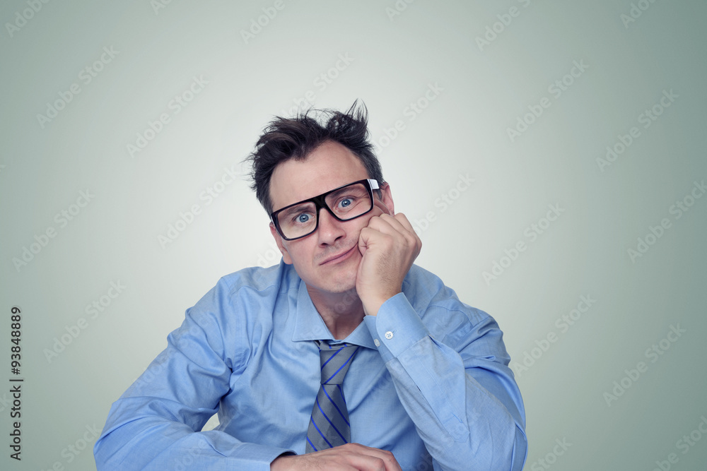 Thinking businessman in glasses
