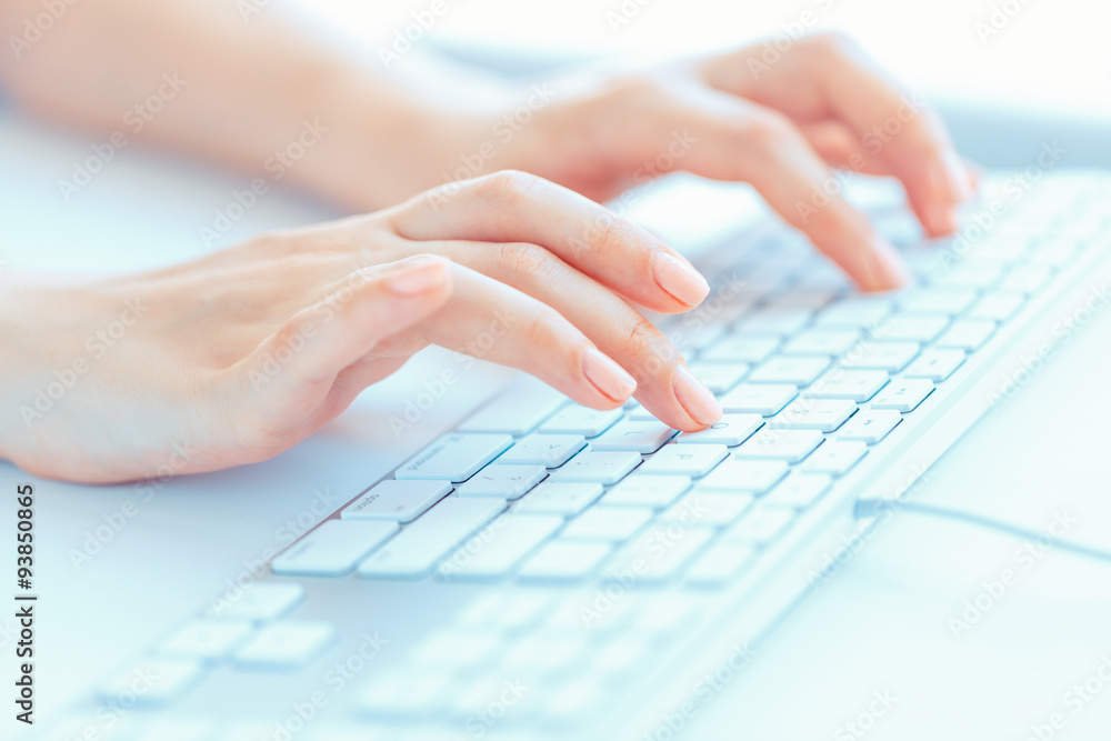 Female hands or woman office worker typing on the keyboard Female hands or woman office worker typing on the keyboard