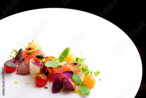 Fototapeta Naklejka Na Ścianę i Meble -  Haute cuisine appetizer with tuna tartare, watermelon and spices
