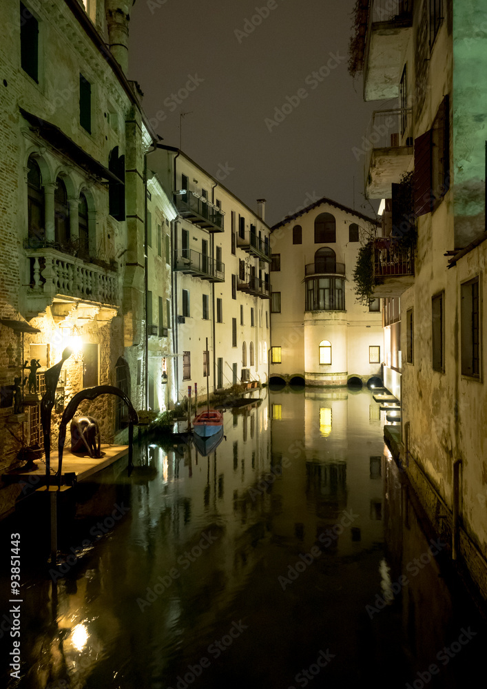 Night view of Treviso canal and buildings