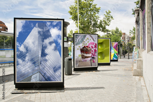 billboards with photographs at city street photo