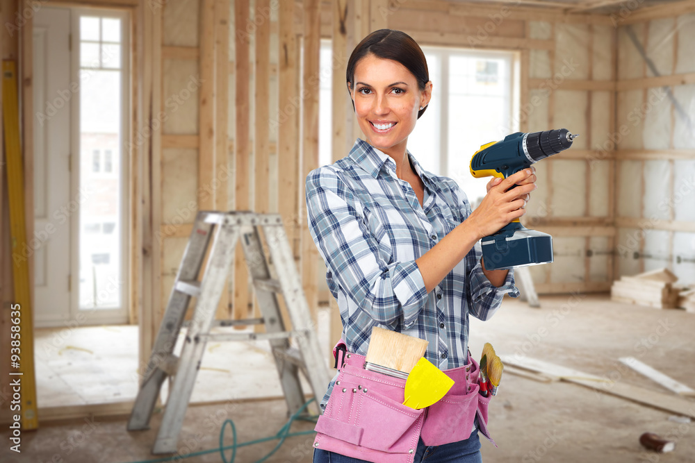 Young woman with a drill. Young woman with a drill.