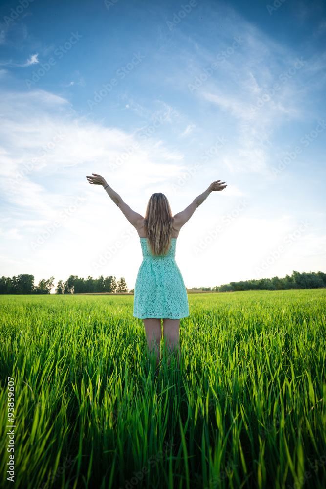 Happiness woman stay outdoor under sunlight of sunset Happiness woman stay outdoor under sunlight of sunset