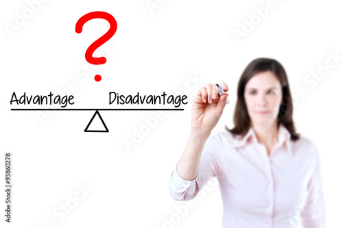 Young business woman writing advantage and disadvantage compare on balance bar. Isolated on white background.