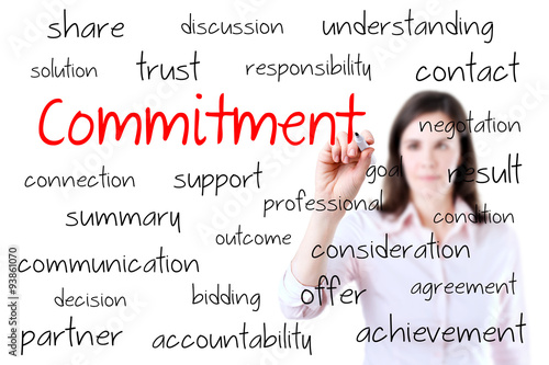 Young business woman writing commitment concept. Isolated on white.