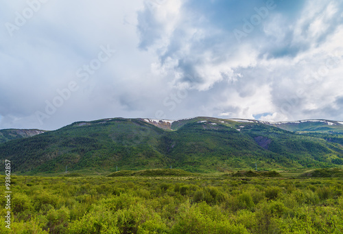 clouds over the mountain range of Altai summer sunny day