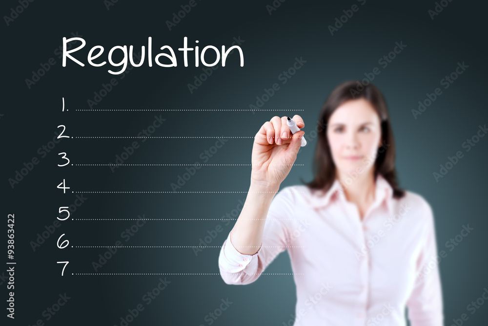 Business woman writing blank regulation list. Blue background. Business woman writing blank regulation list. Blue background.