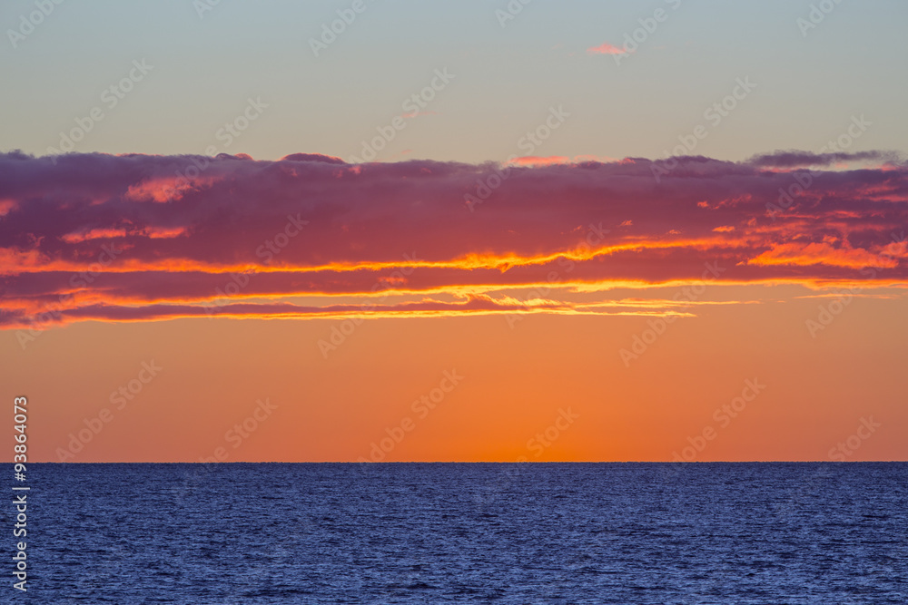 sunset over the blue waters of Northumberland Strait, Prince Edward Island, Canada