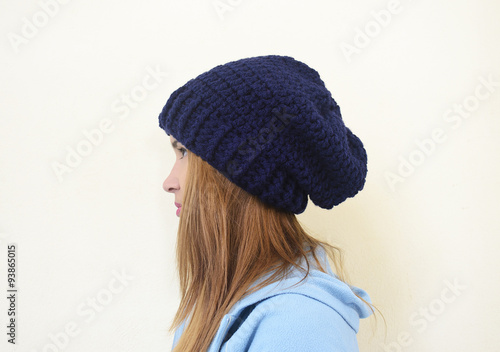 girl profile wearing a chunky crochet beanie