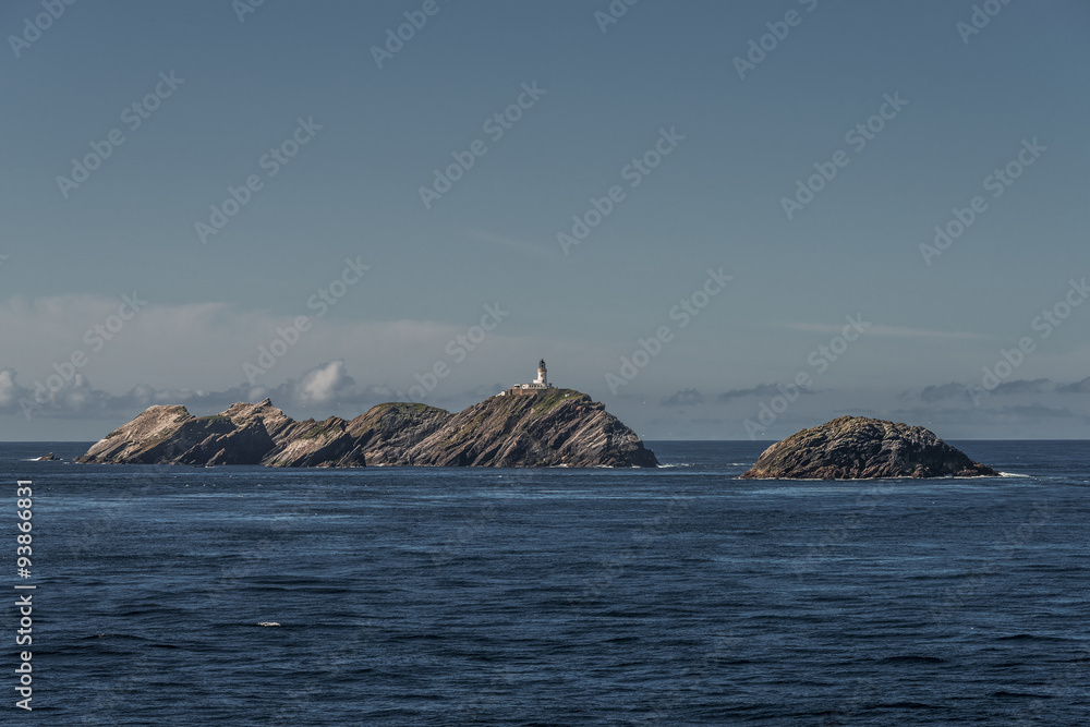 Naklejka premium Lighthouse at beautiful Faeroe islands, summer time