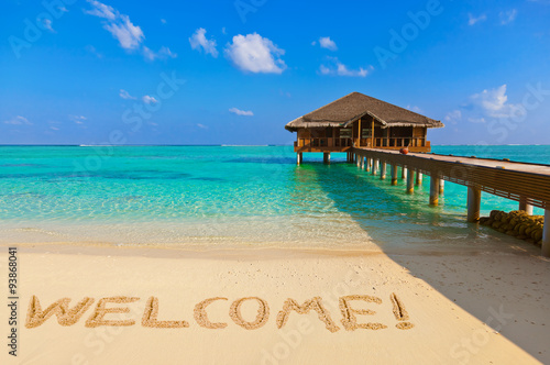 Word Welcome on beach