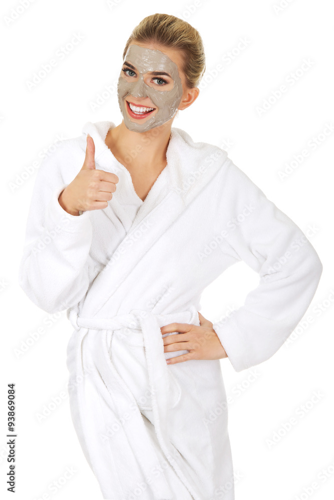 Young woman with facial mask shows OK sign. Young woman with facial mask shows OK sign.