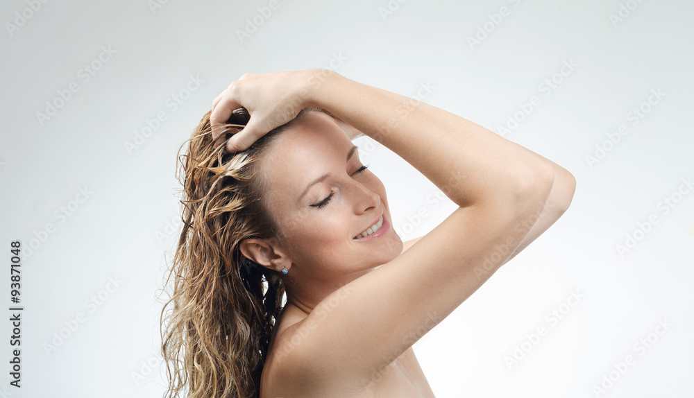 Fototapeta premium woman washes her beautiful hair