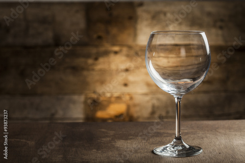 Different glasses on wooden background