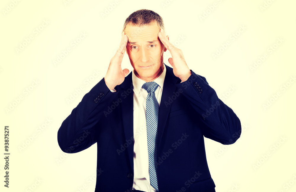 Businessman suffering from headache Businessman suffering from headache