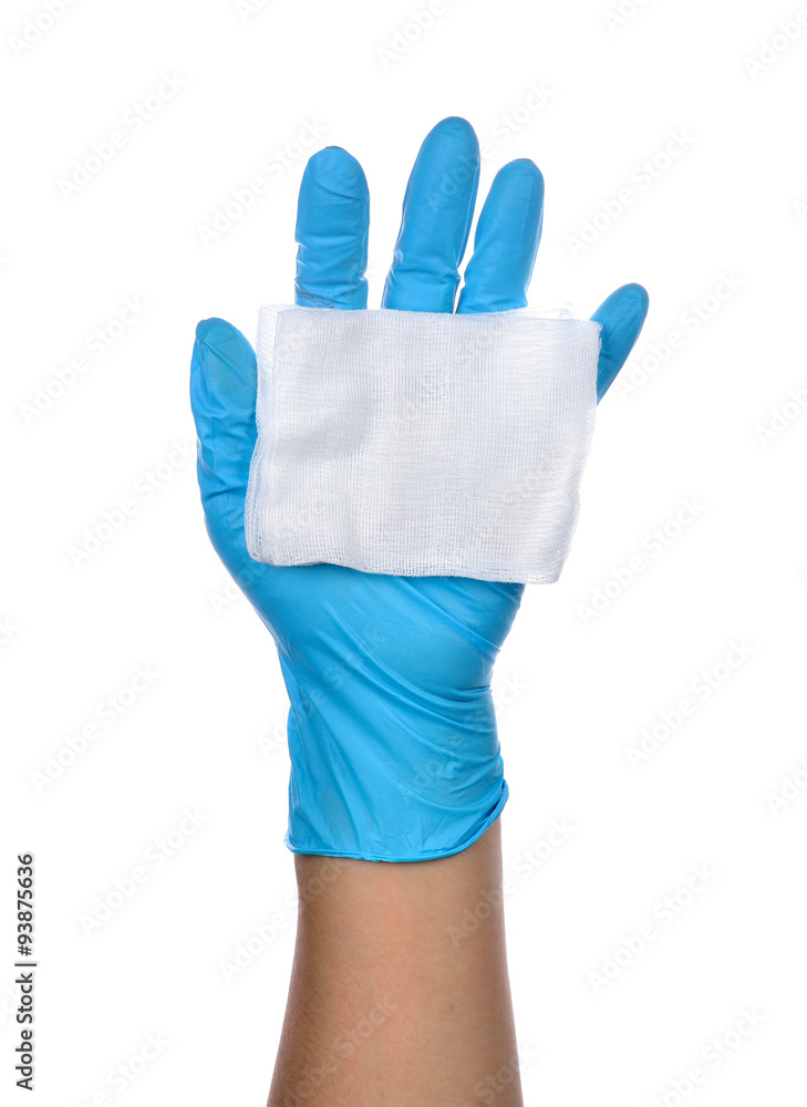 Hands of a medic wearing a blue latex gloves with gauze. Hands of a medic wearing a blue latex gloves with gauze.