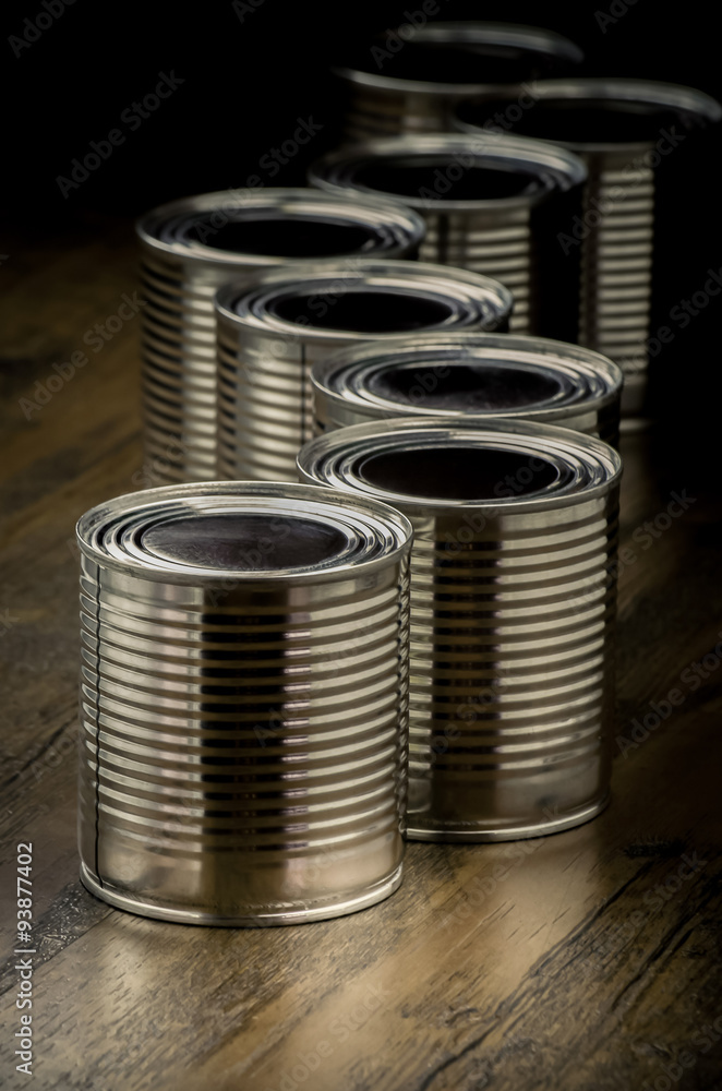 Tin cans for food on wooden background, Selective focus and color effect Tin cans for food on wooden background, Selective focus and color effect
