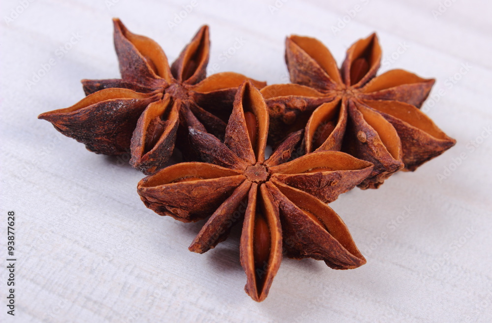 Star anise spice on white wooden table Star anise spice on white wooden table