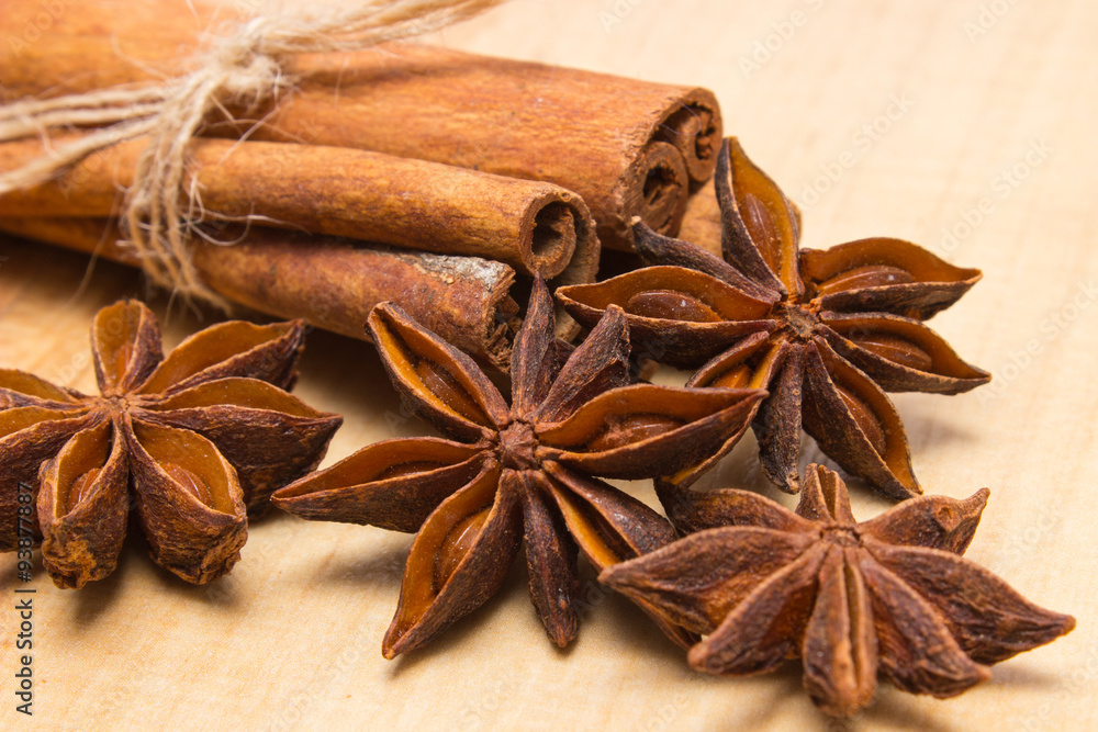 Cinnamon sticks and anise on wooden table, seasoning for cooking Cinnamon sticks and anise on wooden table, seasoning for cooking