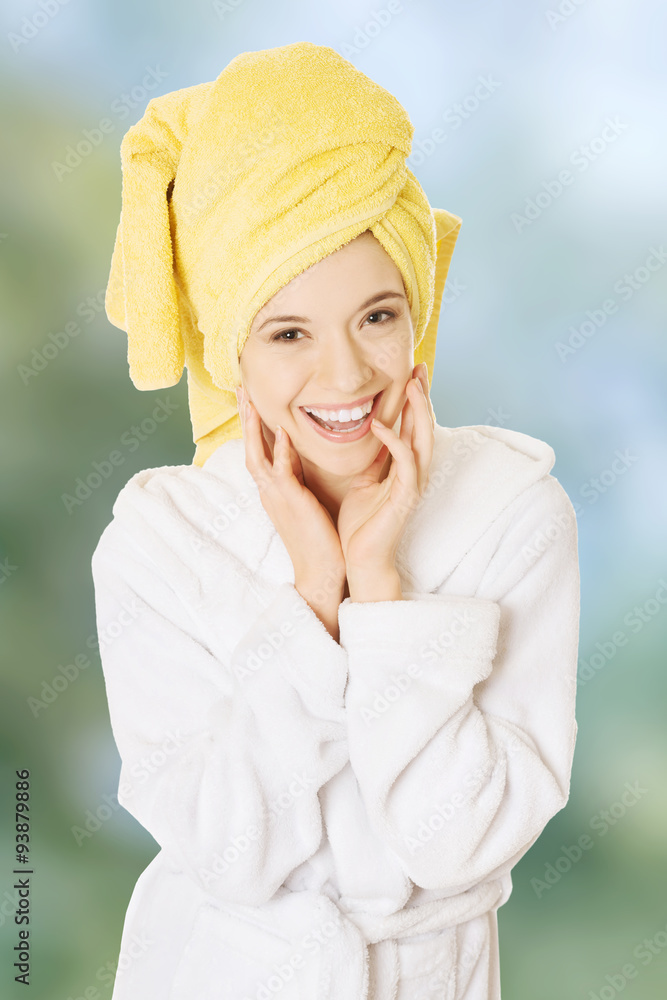 Young smiling woman in bathrobe Young smiling woman in bathrobe