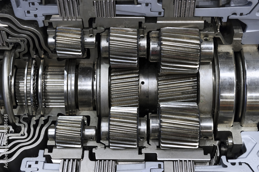 Gearbox cross-section, automotive transmission with sprocket and bearing mechanism for SUV, cargo, and construction vehicles, selective focus Gearbox cross-section, automotive transmission with sprocket and bearing mechanism for SUV, cargo, and construction vehicles, selective focus
