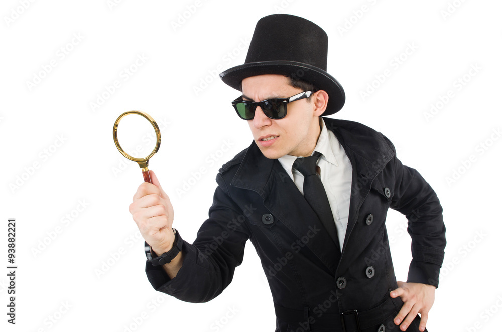 Young detective in black coat holding magnifying glass isolated Young detective in black coat holding magnifying glass isolated