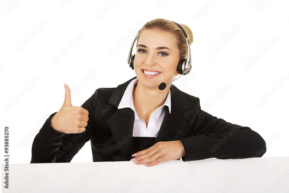 Smille call center woman holding empty banner and showing OK Smille call center woman holding empty banner and showing OK